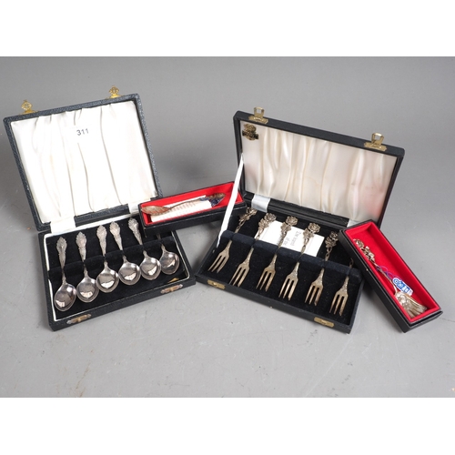 311 - A set of six Continental white metal cocktail forks, marked 800, two similar spoons and a set of sil... 