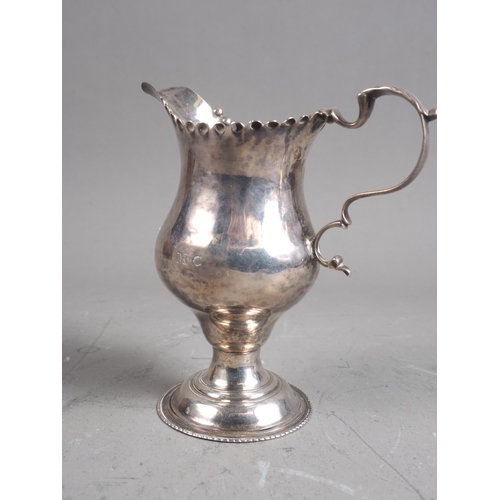 312 - A Georgian silver pedestal cream jug, 3oz troy approx