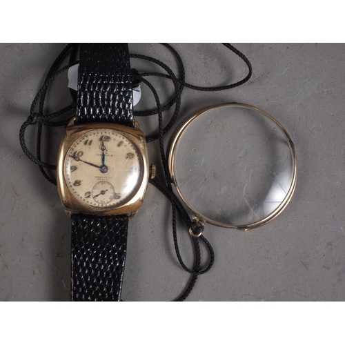 342 - A gentleman's 1930s Omega wristwatch, in Dennison case and leather strap, and a yellow metal framed ... 