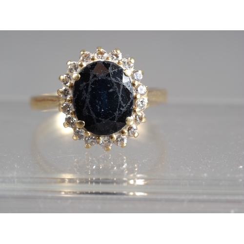 350 - A yellow metal, sapphire and diamond cluster ring, size T/U, 5.8g