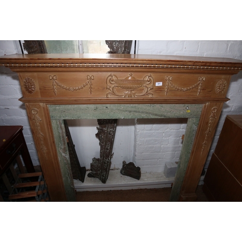 671 - A carved pine fire surround of Georgian design with marble inserts, 56