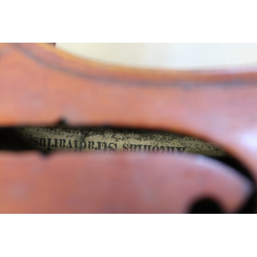 214 - A student's German violin and bow, in fitted case with canvas cover