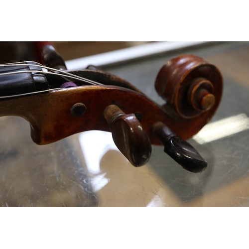 214 - A student's German violin and bow, in fitted case with canvas cover