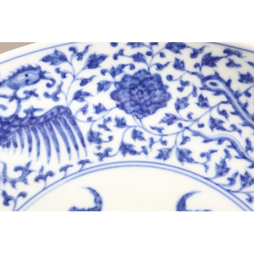 91 - A Chinese blue and white porcelain dish, decorated three phoenix and arabesques, seal mark to base, ... 