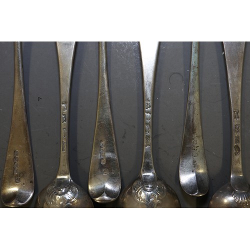 305 - A set of six Georgian silver shell bowl teaspoons with bright cut decoration, and a number of Georgi... 