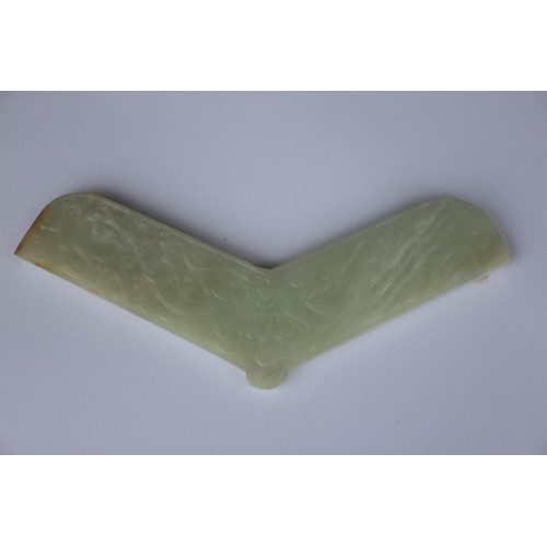 113 - A Chinese pale celadon jade angular pendant, decorated two dragons, 6 3/4