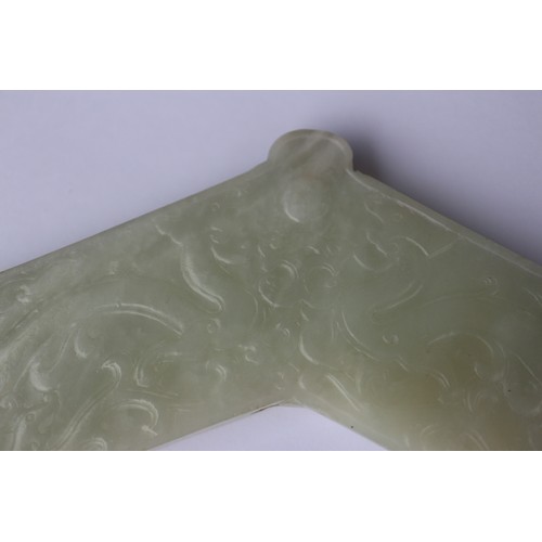 113 - A Chinese pale celadon jade angular pendant, decorated two dragons, 6 3/4