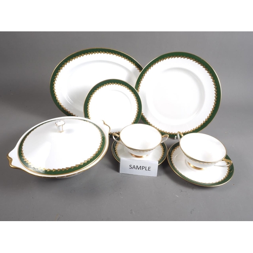 34 - A Royal Albert bone china green and gilt decorated part dinner service, 42 pieces approx (some damag... 