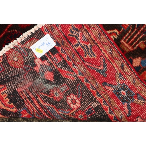 614 - A Persian Nahavan wool runner of traditional design, on a deep ground, 126