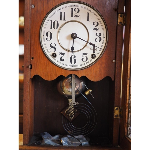 106 - An American walnut mantel/shelf clock with Aesthetic mount gilt decorated door, striking on bell and... 