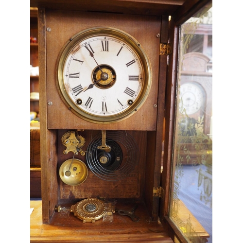 112 - An American walnut mantel/shelf clock striking on bell and gong, 24