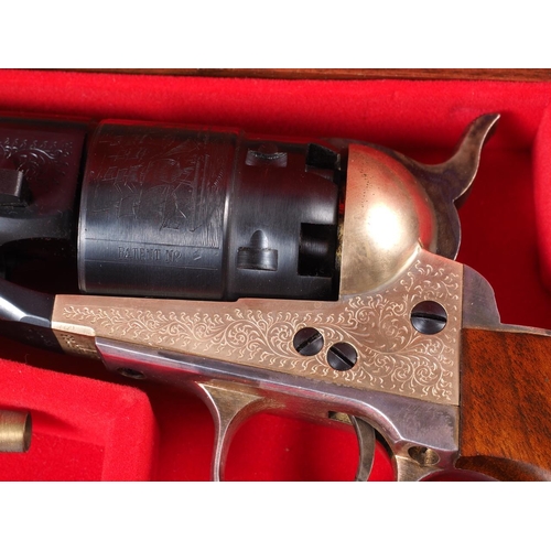 176 - A replica percussion cap Colt pistol with blued engraved steel barrel and cylinder, in fitted walnut... 