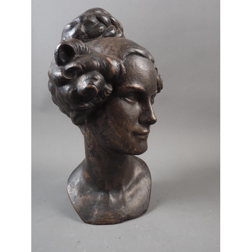 216 - A patinated portrait head of an early Victorian woman, 10 1/2