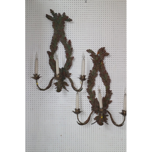 244 - A pair of painted stamped metal, oak and laurel leaf three-light wall brackets, 28