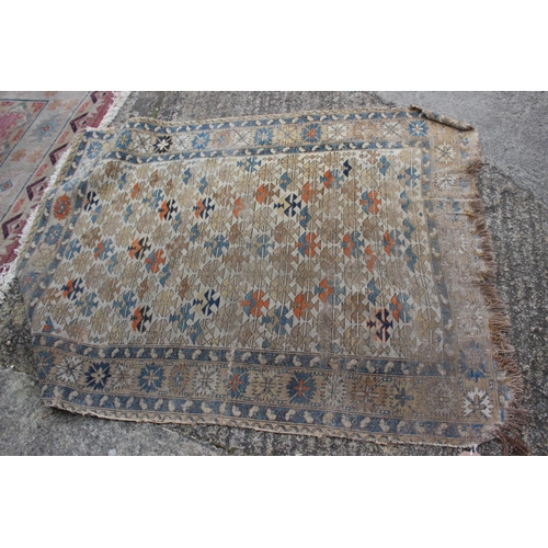 617 - A Persian tribal rug with all-over geometric design, on a cream ground, 52