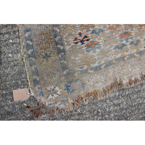 617 - A Persian tribal rug with all-over geometric design, on a cream ground, 52