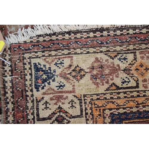 618 - A Qashqai rug with animals in a central medallion and multi-borders in shades of brown, red, blue, b... 