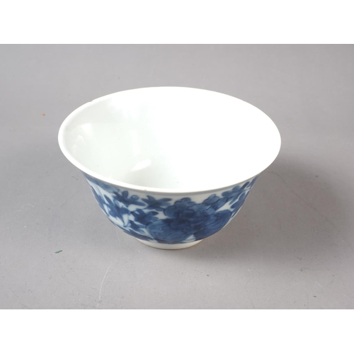 82 - A Chinese porcelain blue and white tea bowl with six-character mark, 4