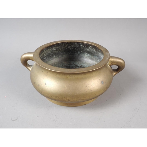 86 - A Chinese bronze two-handled censer, 5 1/2