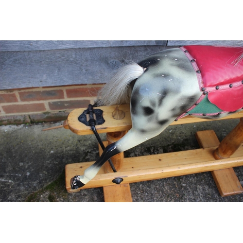 192 - A dappled grey rocking horse, 36