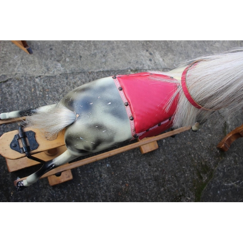 192 - A dappled grey rocking horse, 36