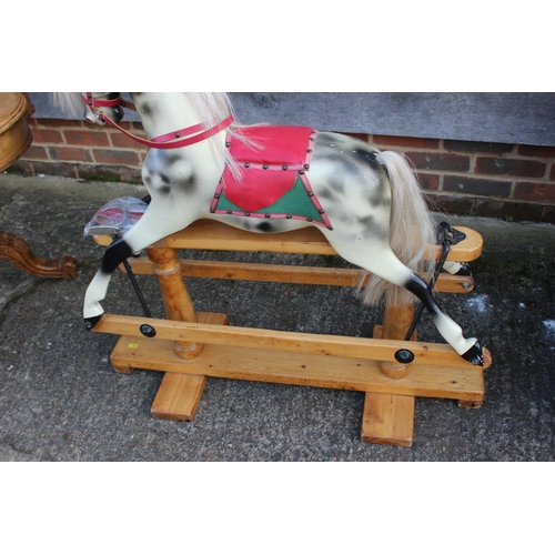 192 - A dappled grey rocking horse, 36