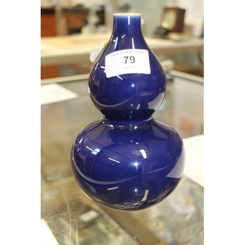 73 - A Chinese monochrome blue glazed double gourd vase, 7 1/4