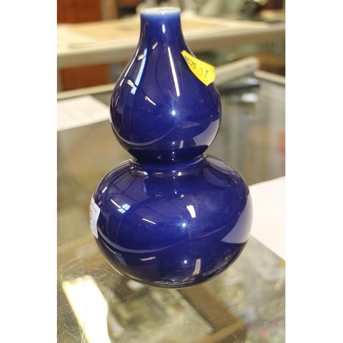 73 - A Chinese monochrome blue glazed double gourd vase, 7 1/4