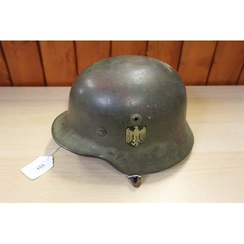 155 - A 1940 Wehrmacht steel helmet M35, with double decal, some rust, with leather liner and chin strap, ... 