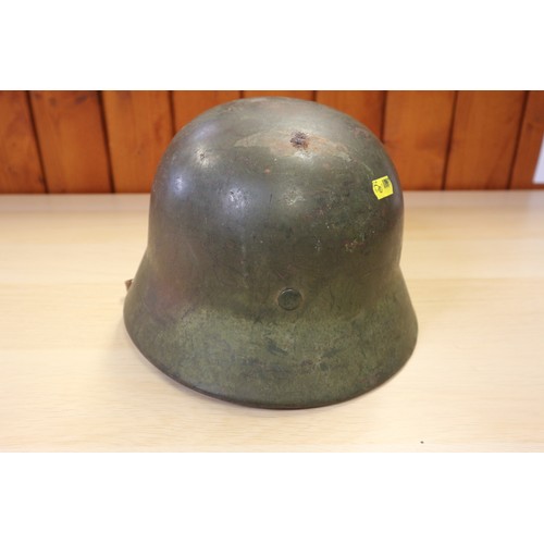 155 - A 1940 Wehrmacht steel helmet M35, with double decal, some rust, with leather liner and chin strap, ... 