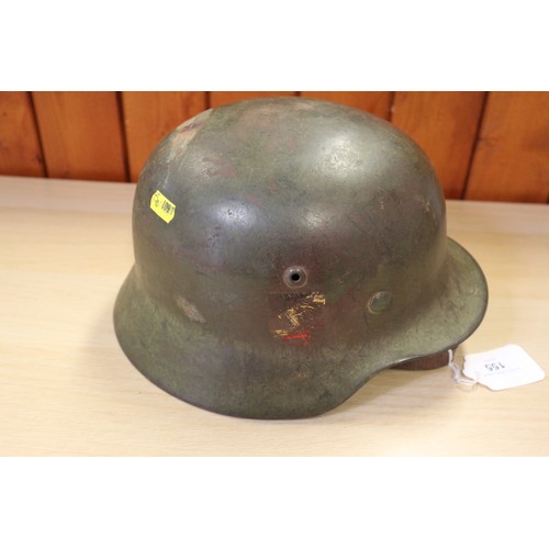 155 - A 1940 Wehrmacht steel helmet M35, with double decal, some rust, with leather liner and chin strap, ... 