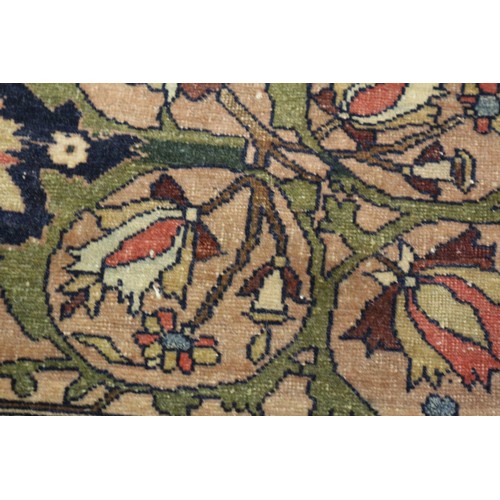 622 - A Persian city rug with all-over flower and scroll design, on a blue ground and multi-boarded in sha... 