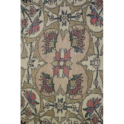 622 - A Persian city rug with all-over flower and scroll design, on a blue ground and multi-boarded in sha... 