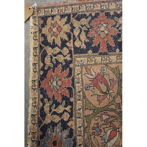 622 - A Persian city rug with all-over flower and scroll design, on a blue ground and multi-boarded in sha... 