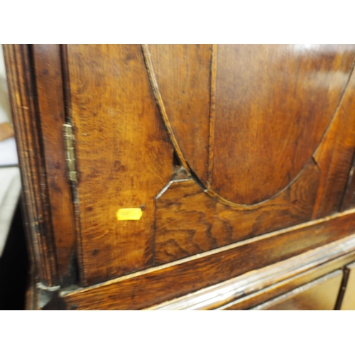 432 - An oak linen press with box and ebony strung cornice, enclosed two doors (missing internal drawers) ... 