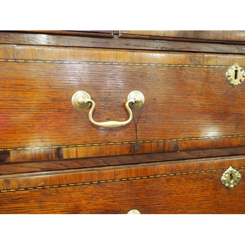 430 - An early Georgian oak, mahogany banded and box and ebony strung chest on chest, the upper section fi... 