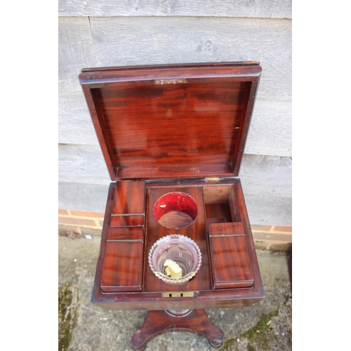 439 - A 19th century mahogany teapoy with three caddies and blending bowl (as found), on faceted column an... 