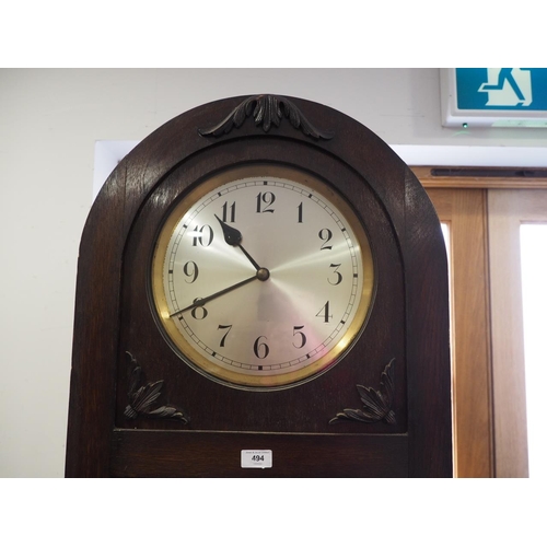 464 - An early 20th century oak cased arch topped long case clock with silvered dial and Arabic numerals, ... 