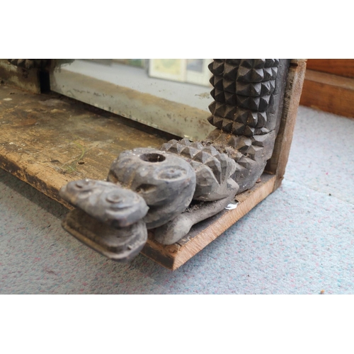 467 - An early 20th century overmantel mirror with four carved animal uprights, 72