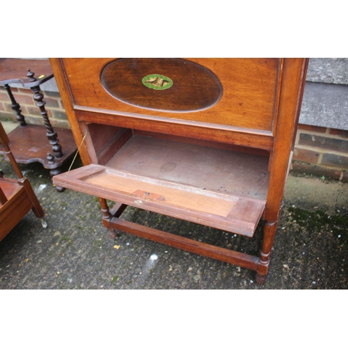 492 - An oak side cabinet with lift-up lid and drop-down compartment, on turned and stretchered supports, ... 