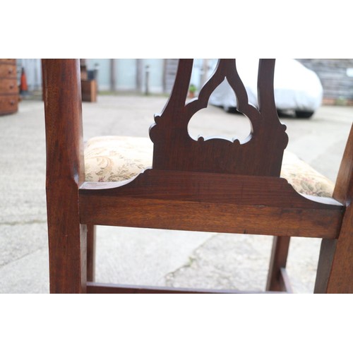 429 - A pair of late Georgian mahogany shaped pierced twin splat dining chairs with serpentine stuffed ove... 