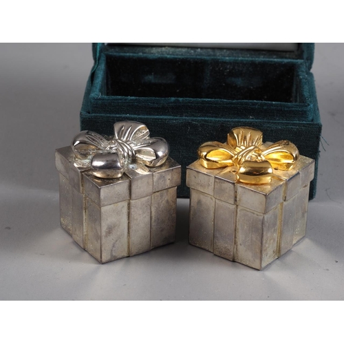 214 - Two pairs of silver plated and gilt pepperettes, in cases