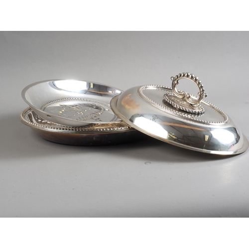 225 - An oval silver plated entree dish, cover and handle, with beaded rims