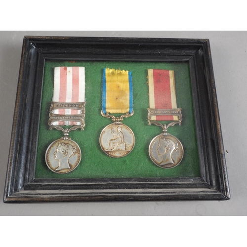 291 - A set of three  well reproduced Victorian Indian campaign medals, including Lucknow bar, Defence of ... 