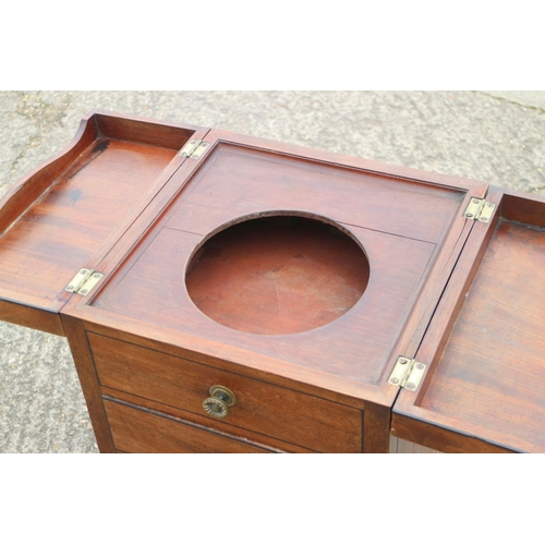 413 - A late 19th century mahogany and ebony strung washstand with hinged top over drawer and cupboard, 16... 