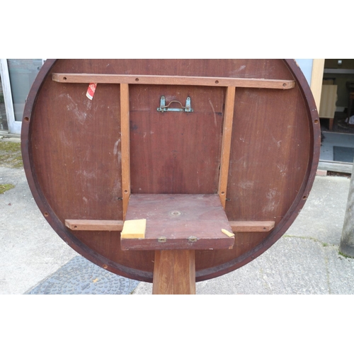 415 - A mid Victorian mahogany circular tilt top dining table, on faceted column, triform base and lion pa... 