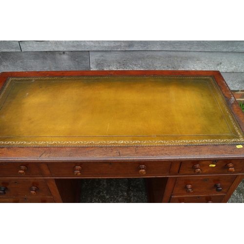 437 - A 19th century walnut double pedestal desk with tooled leather lined top over nine drawers, on block... 