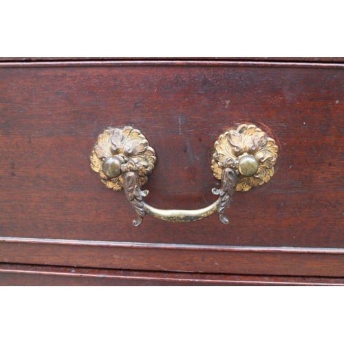 441 - A George III mahogany chest of four long graduated drawers with gilt brass bail handles, on bracket ... 