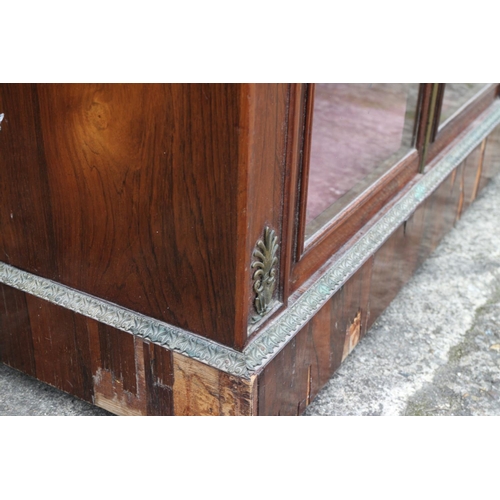 446 - A mid 19th century rosewood, brass line inlaid and gilt brass mounted pier cabinet enclosed two door... 