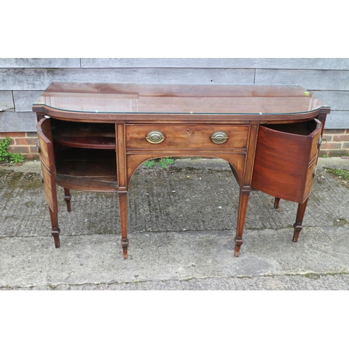 452 - A George III mahogany break bowfront sideboard, fitted cupboard, centre drawer and cellarette (no li... 